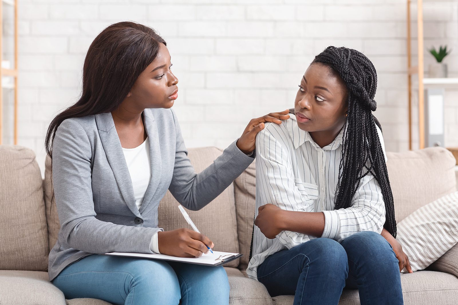 Counseling Psychology. Psychotherapist Comforting Sad Female Pat