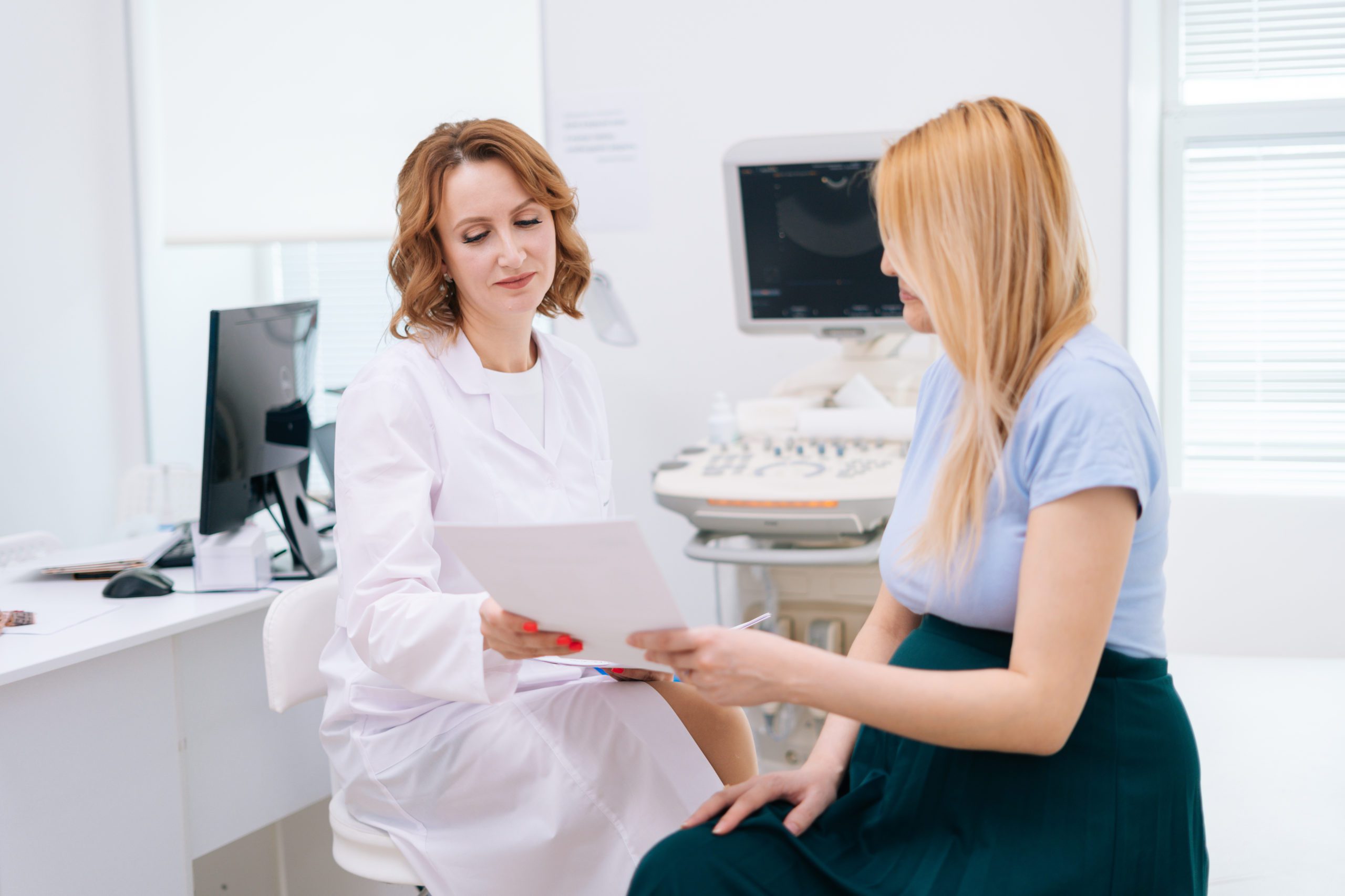 Female Doctor Transmits Results Of Ultrasound Examination To Pre